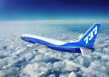 Boeing 737 Max flies above the clouds.