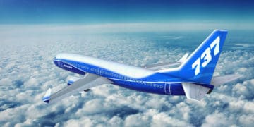 Boeing 737 Max flies above the clouds.