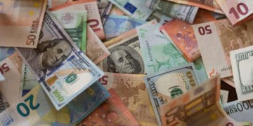 A pile of different currencies from around the world