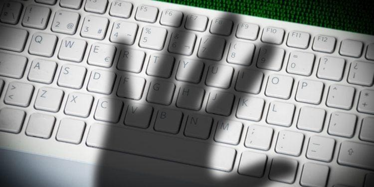 shadow of hand on keyboard