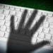 shadow of hand on keyboard