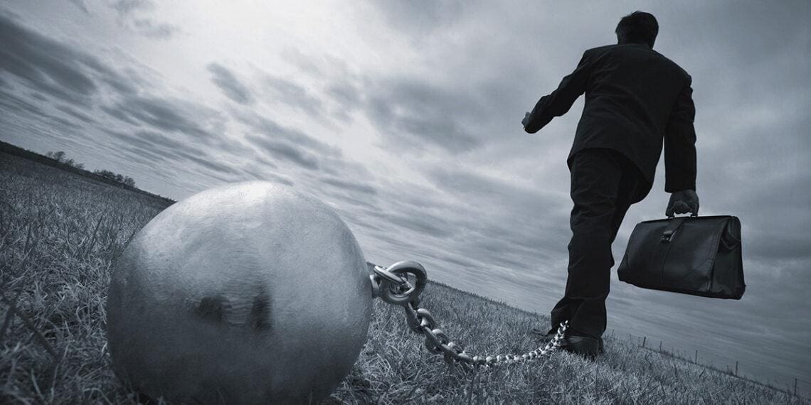 ball and chain on businessman