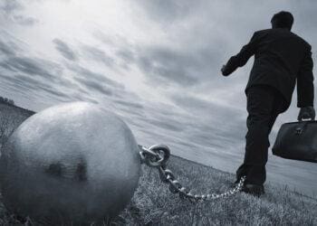 ball and chain on businessman