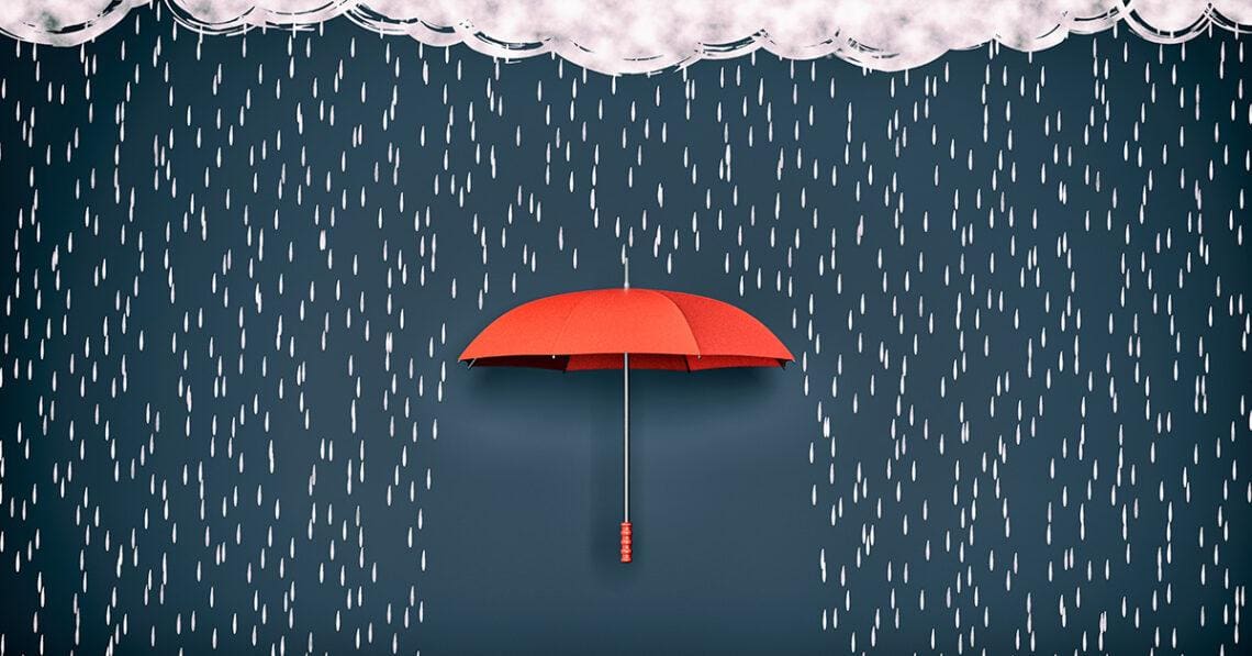 red umbrella blocking rain