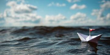 paper boat in ocean