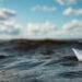 paper boat in ocean