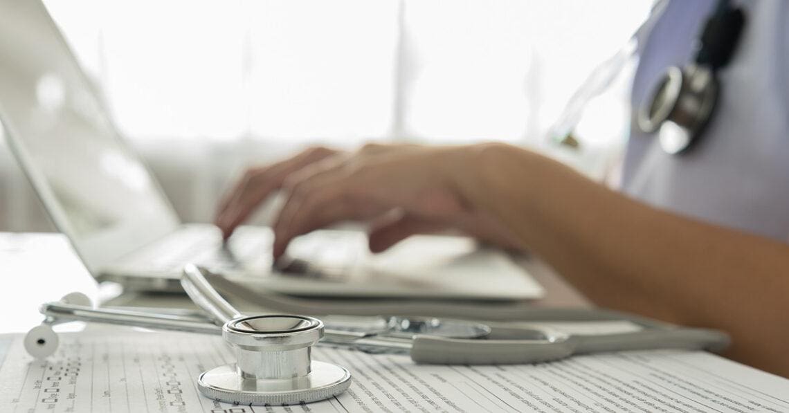 Medical professional enters information into electronic medical record