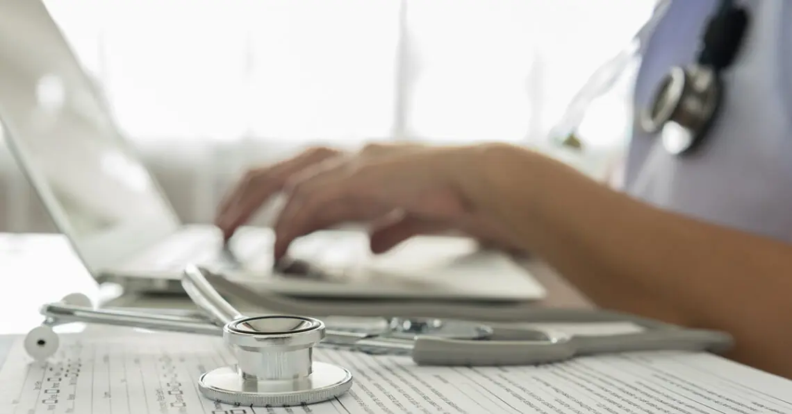 Medical professional enters information into electronic medical record