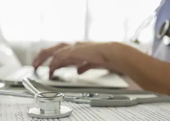 Medical professional enters information into electronic medical record