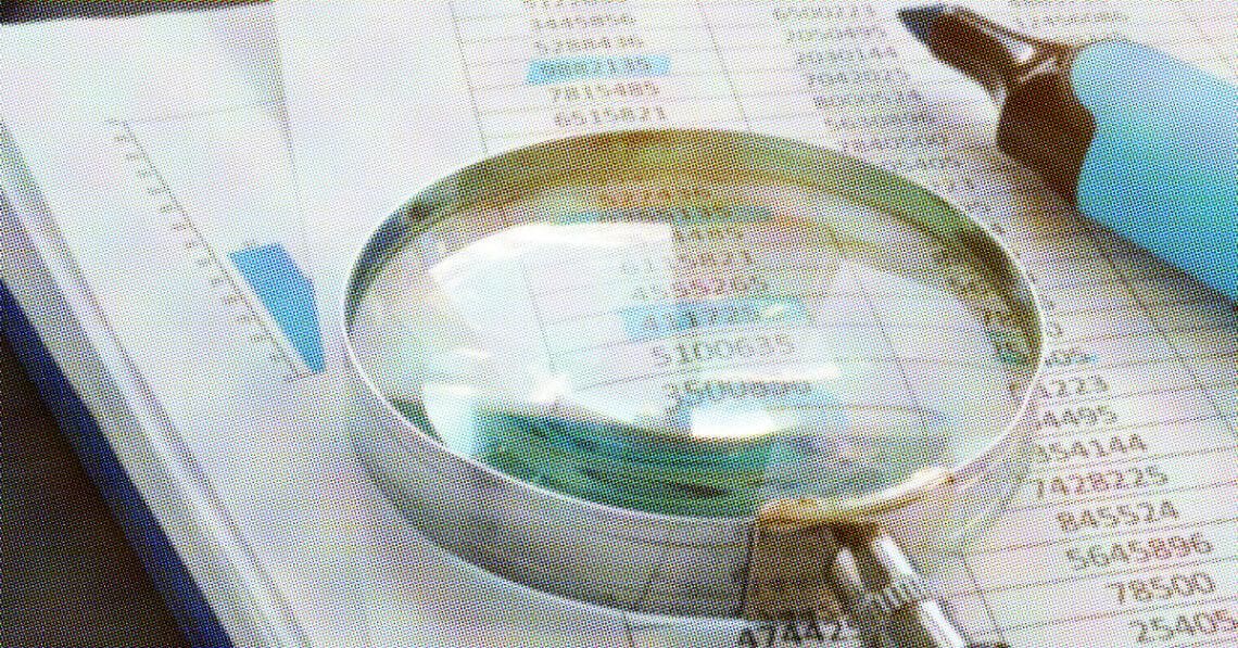 magnifying glass and highlighter on stack of paper