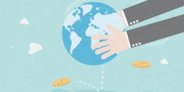 shaking money from the globe