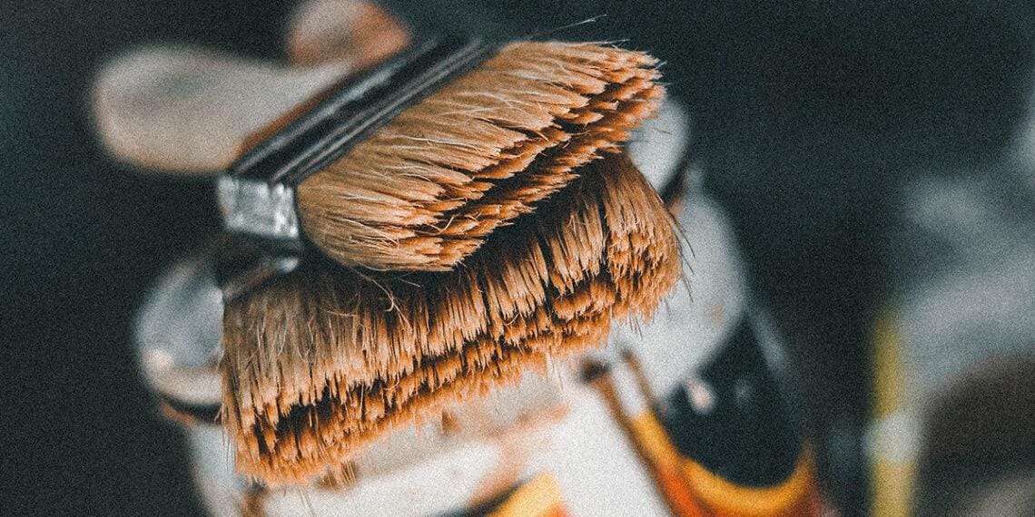 brushes stacked on paint can