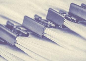 bundle of papers with binder clips