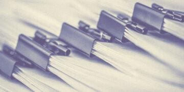 bundle of papers with binder clips