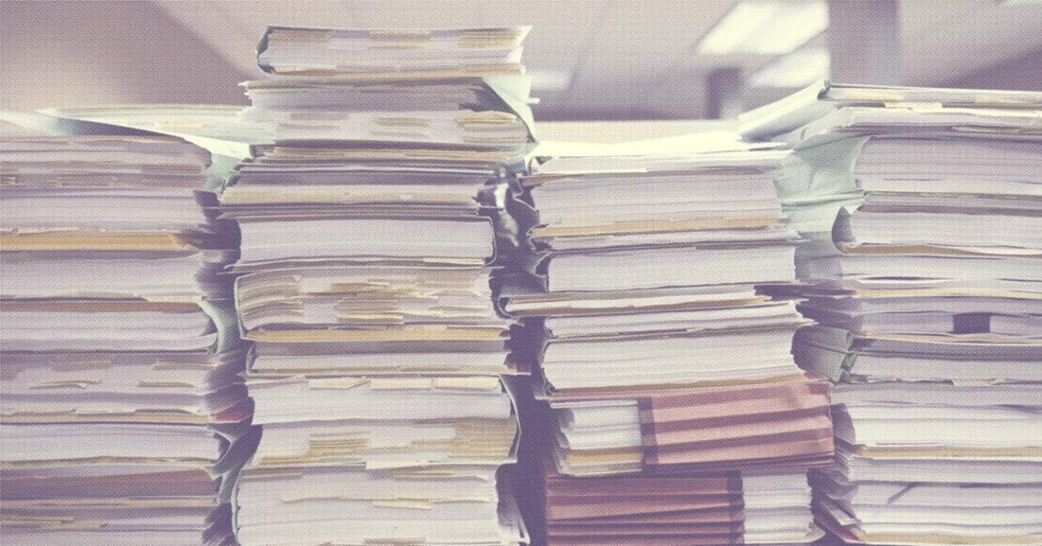papers stacked up in office