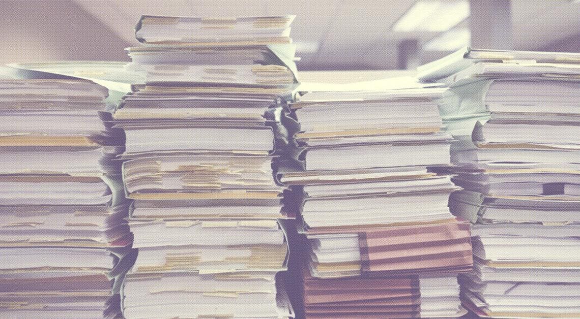 papers stacked up in office