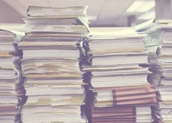 papers stacked up in office