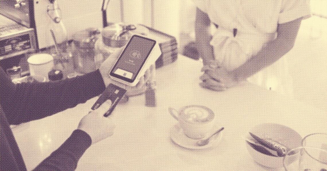 shopper paying for coffee with credit card