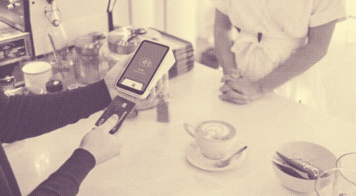 shopper paying for coffee with credit card