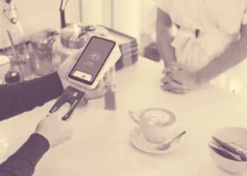 shopper paying for coffee with credit card