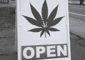 sign in front of weed dispensary