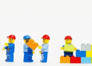 lego workers building a wall