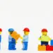 lego workers building a wall