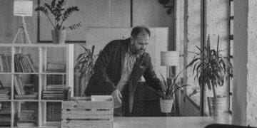 man bringing plants to his office