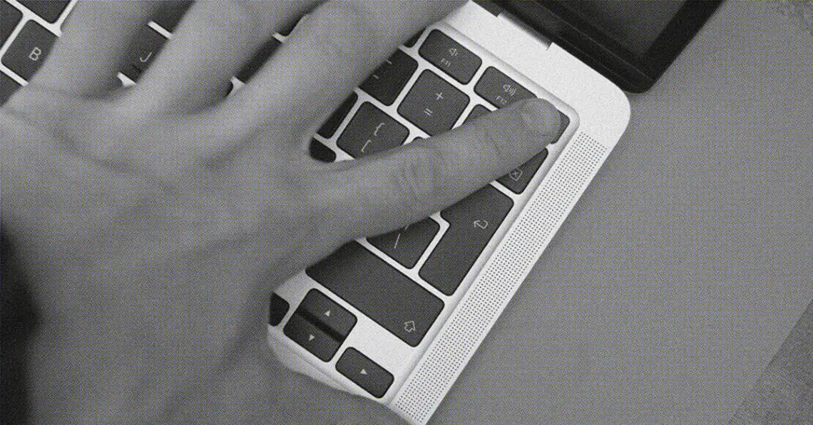 person using computer fingerprint reader