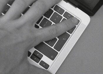 person using computer fingerprint reader