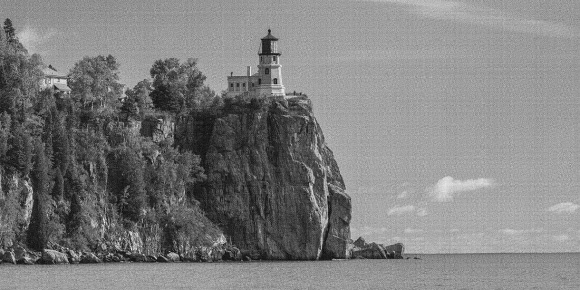 a lighthouse at the edge of a cliff