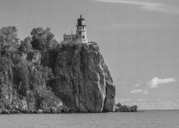 a lighthouse at the edge of a cliff