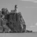 a lighthouse at the edge of a cliff