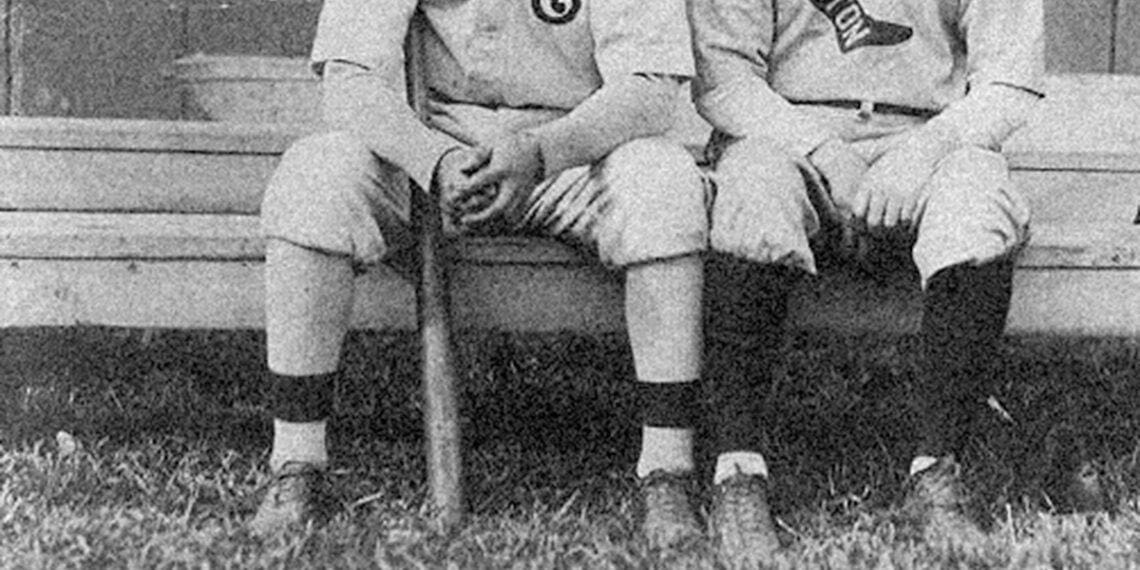 baseball players sitting on bench