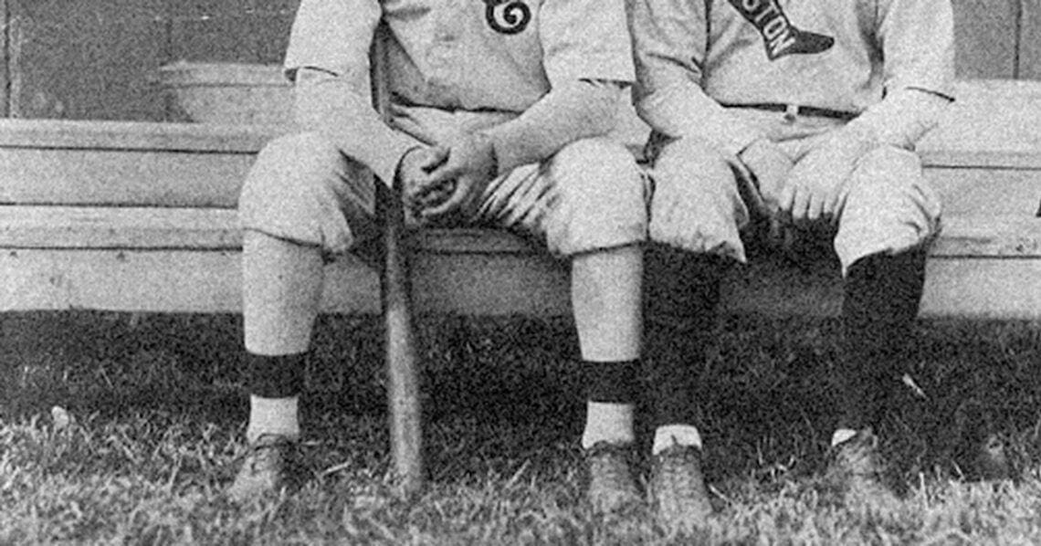 baseball players sitting on bench