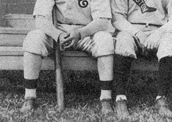 baseball players sitting on bench