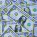 dollar bills piled up