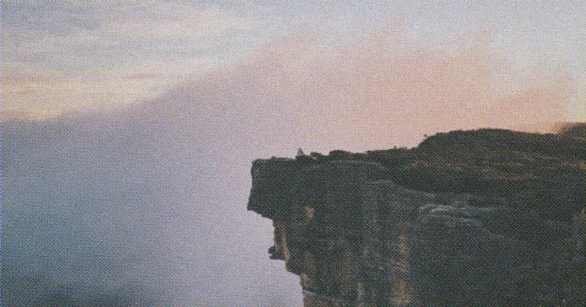 mountain bluff symbolizing risk