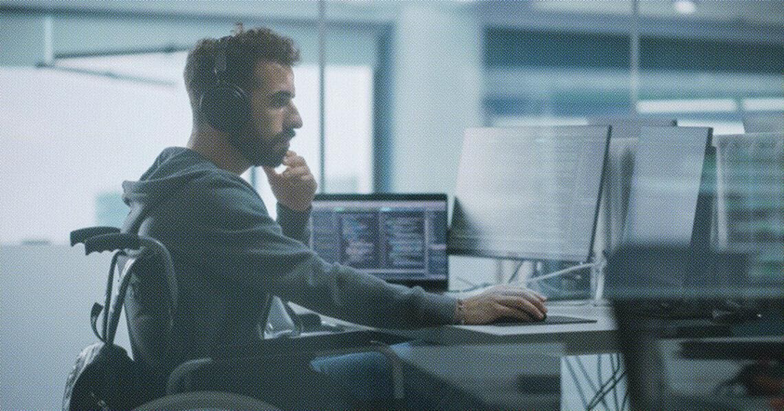 disabled worker at computer desk