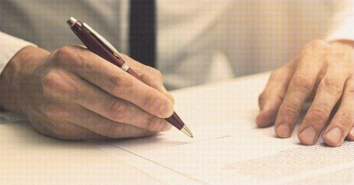 person signing employment contract