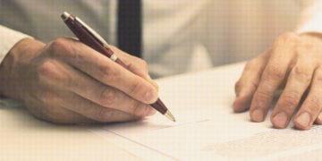 person signing employment contract