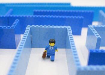lego businessman going through maze