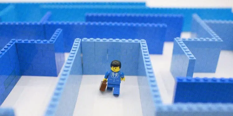 lego businessman going through maze