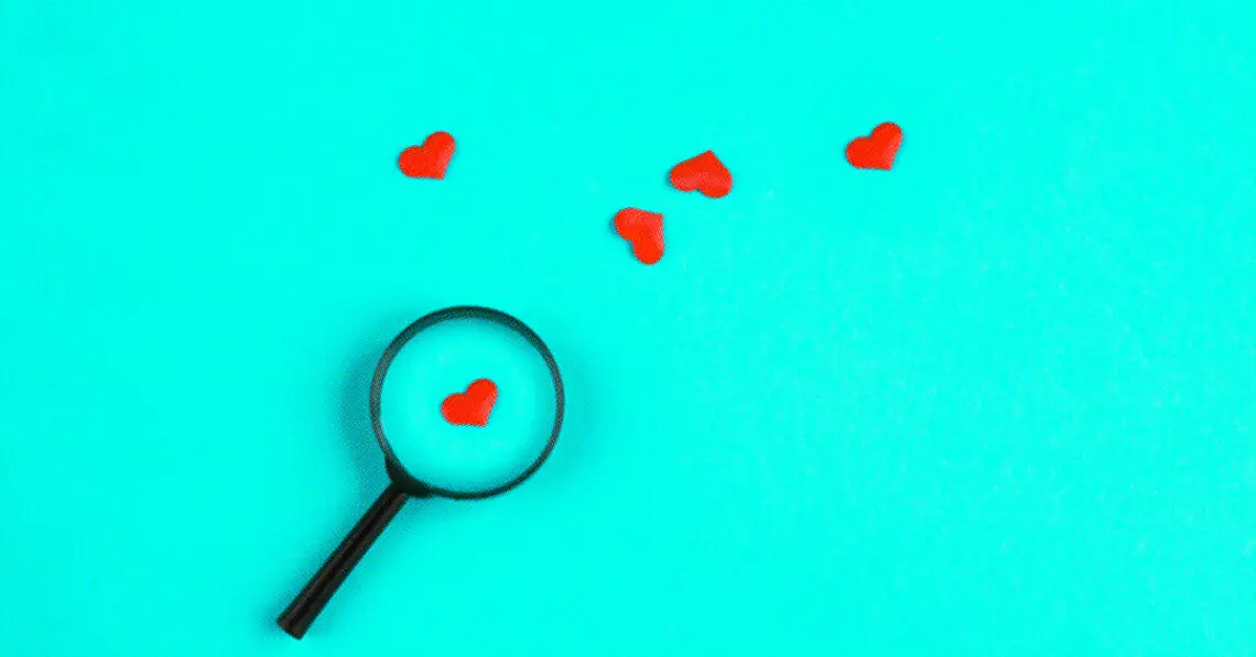 paper hearts with magnifying glass