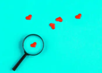 paper hearts with magnifying glass