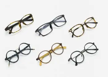 six pairs of eyeglasses lined up