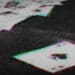 glitchy image of playing cards on table