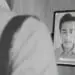 man using facial recognition tablet at work