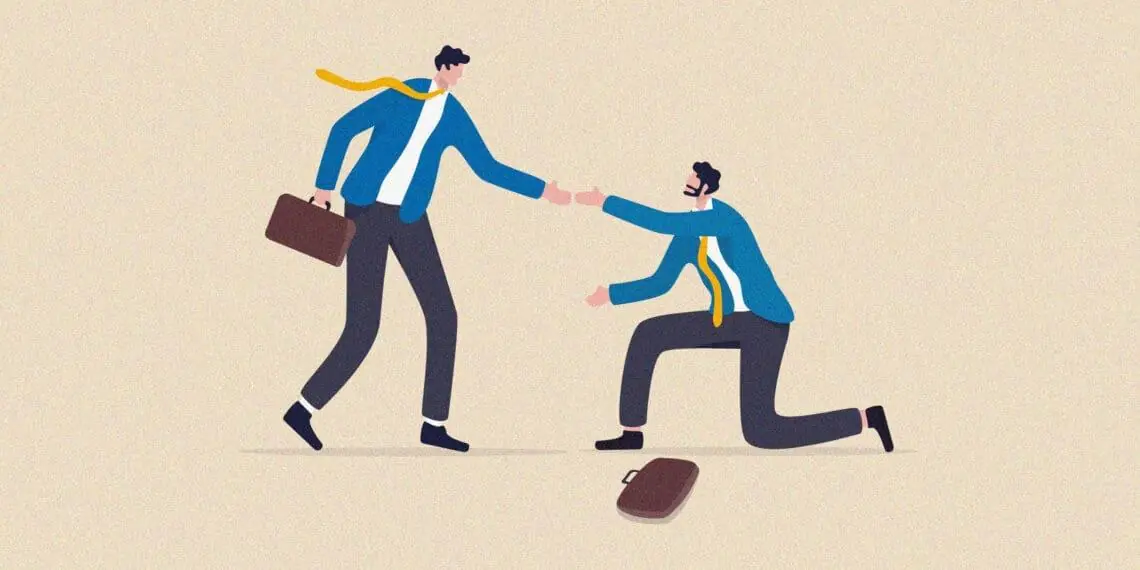 person helping coworker off ground