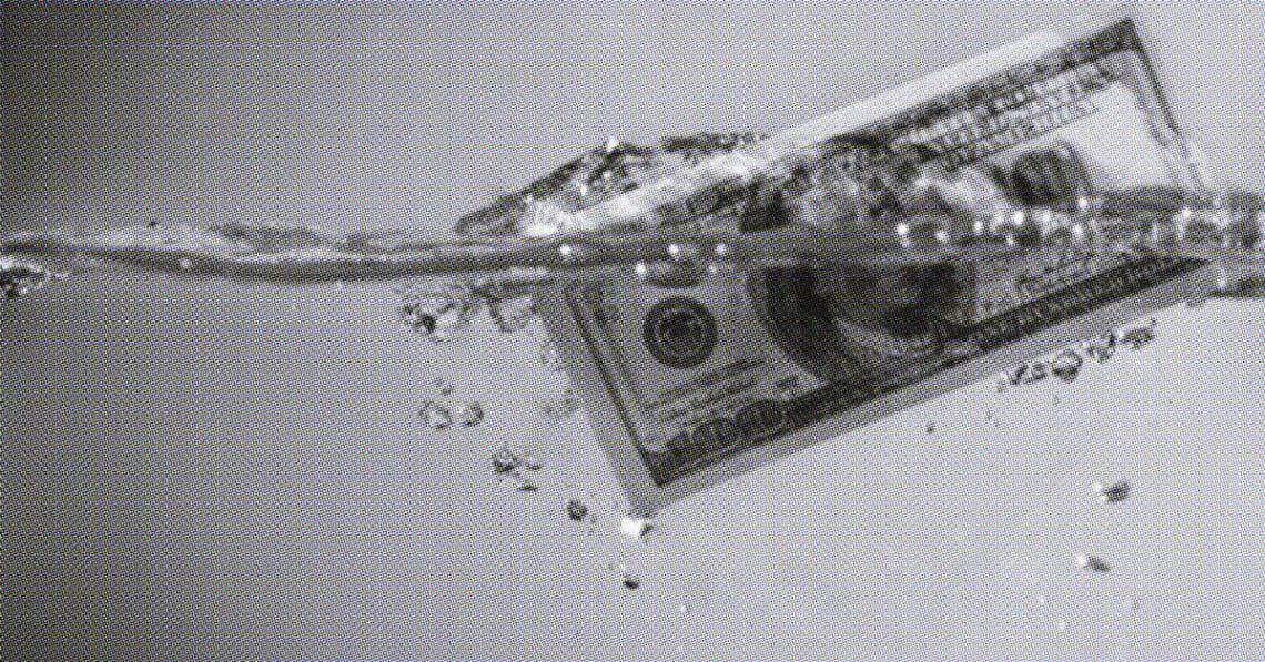 hundred dollar bill floating in water